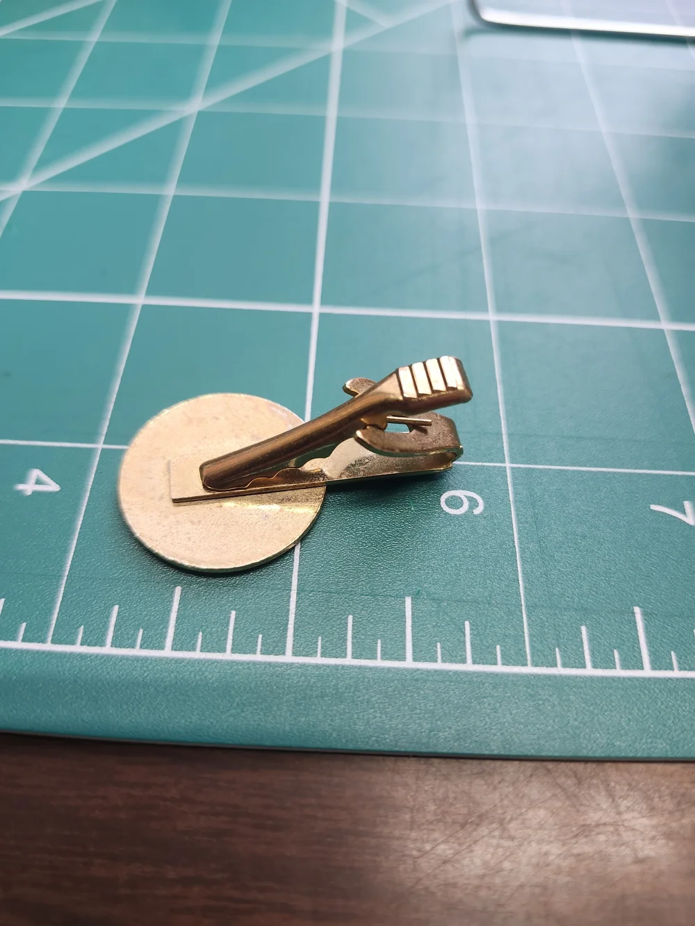 Usher Gold and White Enamel Logo Brooch Tie Clip